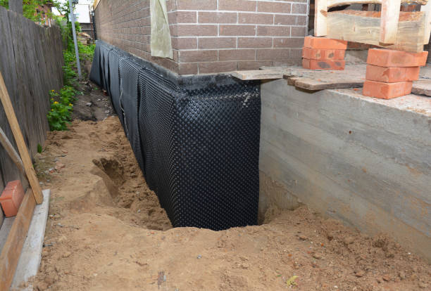 Happy homeowners after waterproofing job in Stillwater